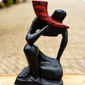 A Horn Blower Carved Scuplture